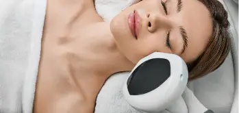 Woman receiving a Lumecca IPL treatment on her face